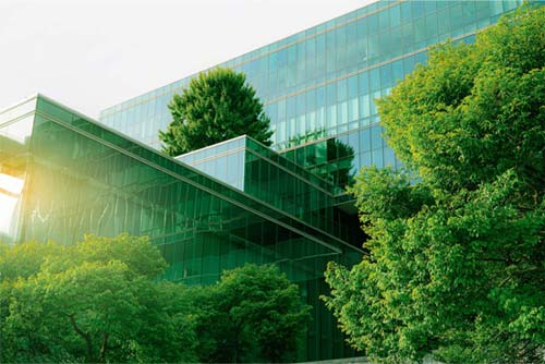 Building with trees around it Building with trees around it