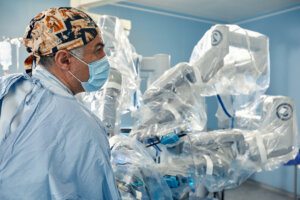 Surgical system with minimally invasive robot in a hospital. Robotic technological equipment, manipulator surgeon in a futuristic operating room. Medical innovation 3D endoscopy for robotic surgery in healthcare