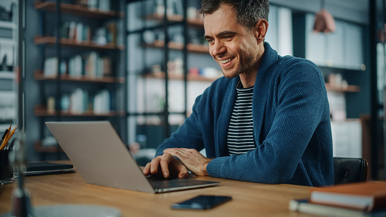 Middle aged man working at his laptop