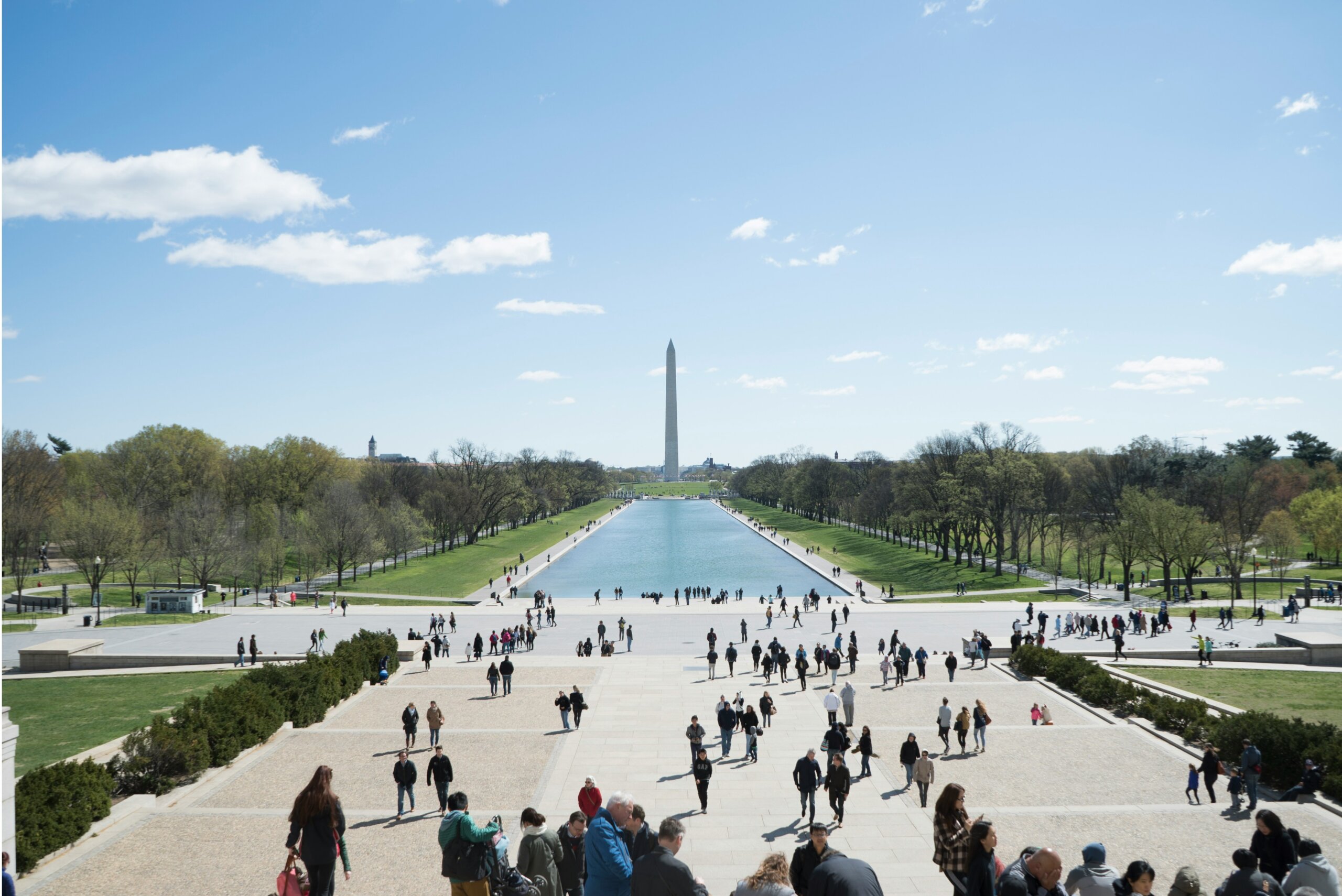The Washington Monument with people walking
