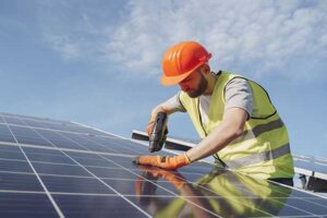Man Working On Solar Panel